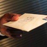 handing-an-envelope